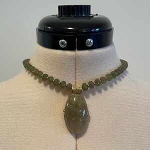 Jade necklace with rutilated quartz pendant